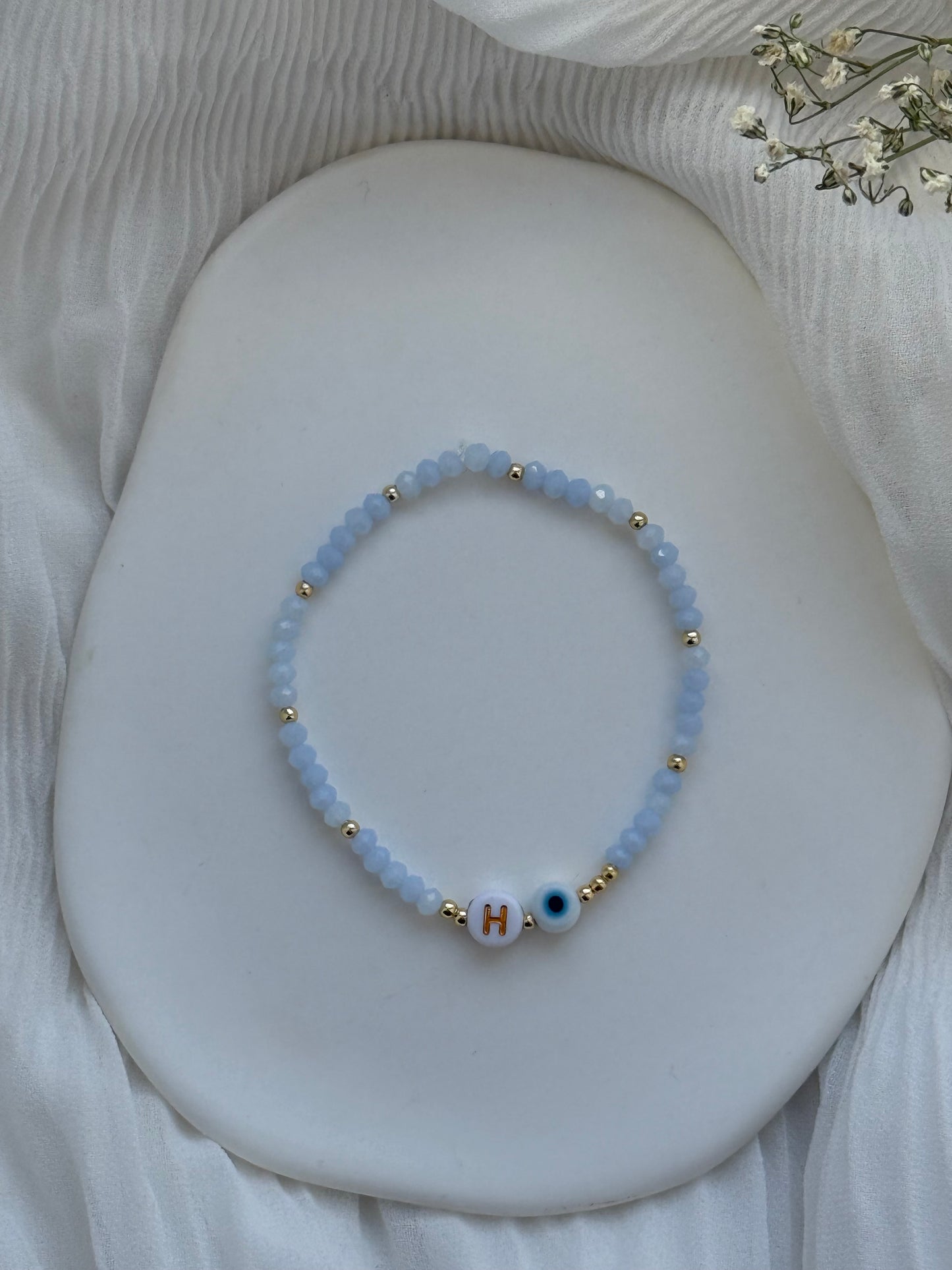 Perlenarmband mit Blauen Kristallperlen, Goldenen Perlen + Nazar Anhänger - 2105