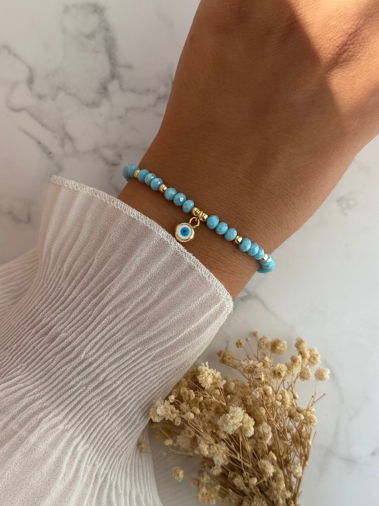 Perlenarmband mit Blauen Kristallperlen, Goldenen Perlen + Nazar Anhänger - 2296