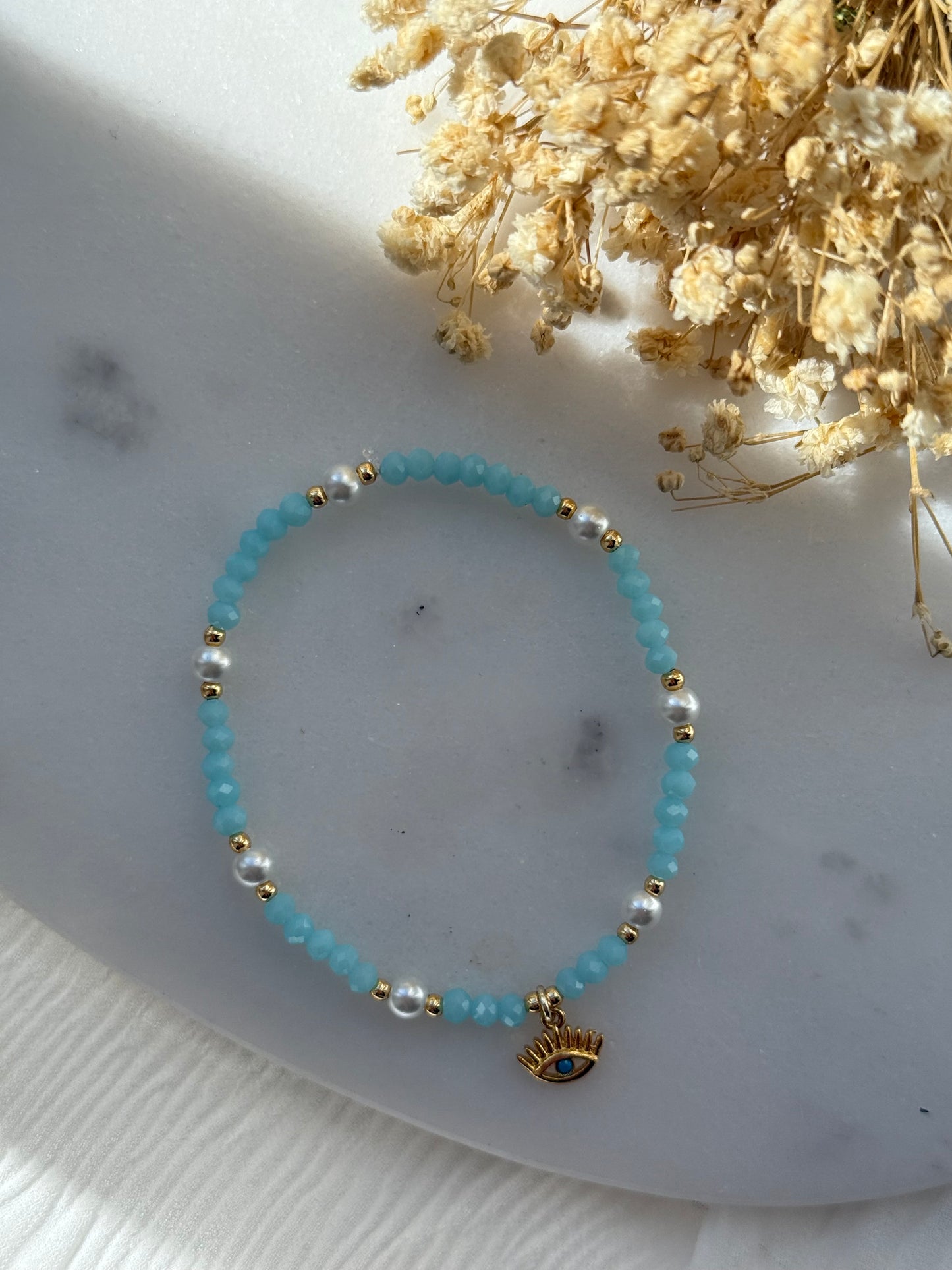 Perlenarmband mit Blauen Kristallperlen und Goldenen Perlen + Nazar Anhänger - 2250
