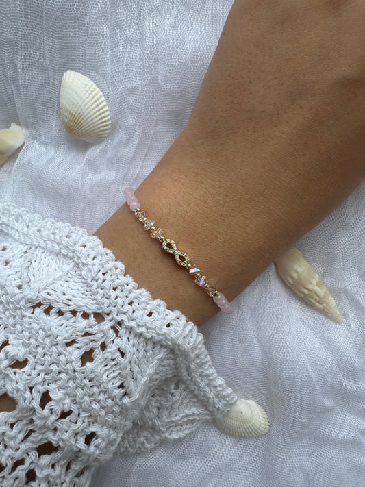 Perlenarmband mit Rosa Kristallperlen und Unendlichkeits Anhänger - 10455