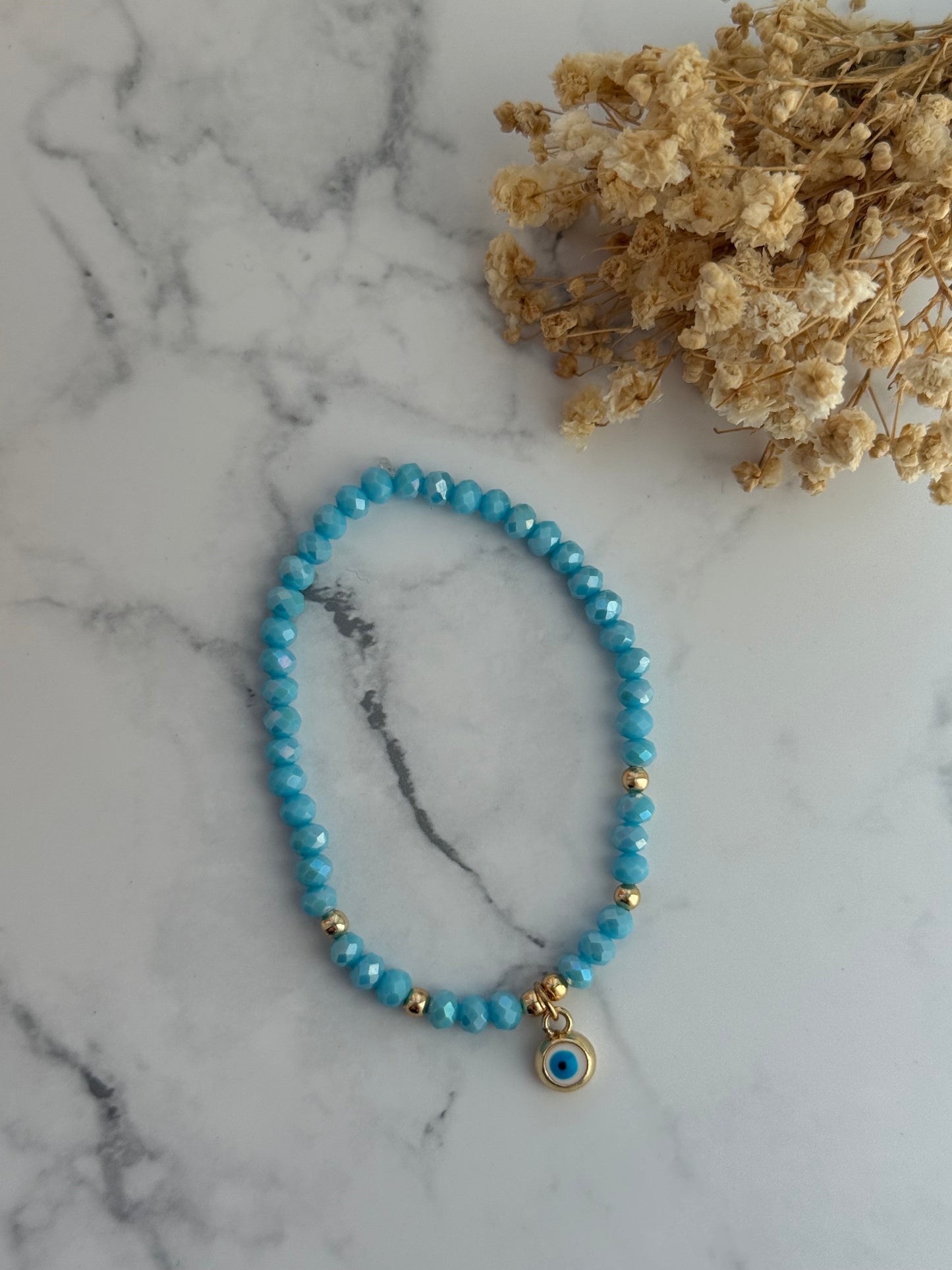 Perlenarmband mit Blauen Kristallperlen, Goldenen Perlen + Nazar Anhänger - 2296