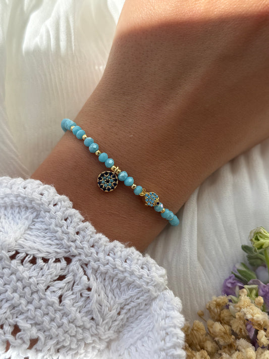 Perlenarmband mit Blauen Kristallperlen, Goldenen Perlen + Nazar und Fisch Anhänger - 2265